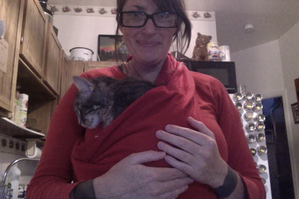 She was very clingy when I brought her home. She wanted to be held and touched constantly. So I made a sling out of a blanket, which she napped in while I washed dishes.