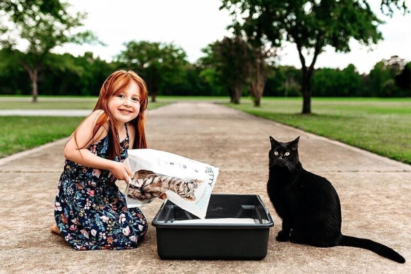 Girl pouring kitty litter