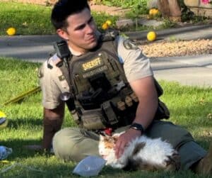 Firefighters comforting rescued cats